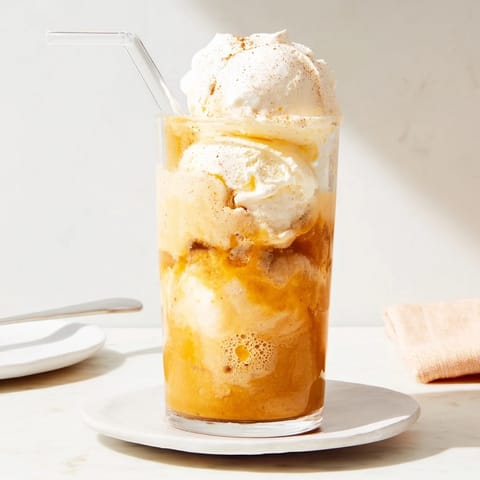 Festive pumpkin cream soda floats featuring creamy ice cream and autumn spices.  