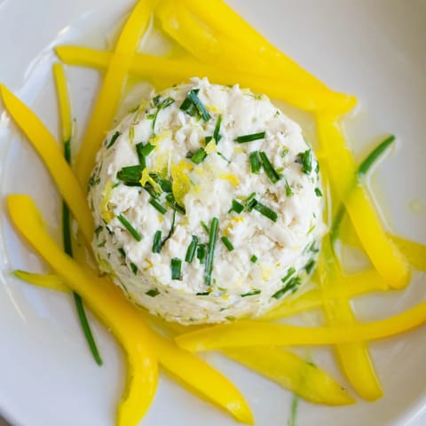 A beautiful Italian Tuscan Sunburst with creamy goat cheese and radiating breadsticks, perfect for serving.