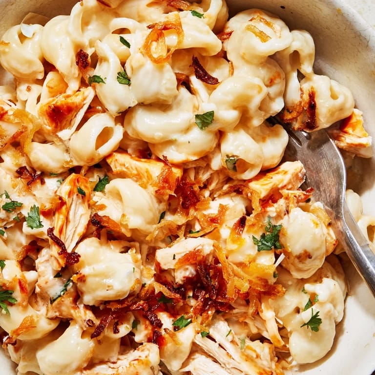 Tender macaroni mixed with BBQ chicken and honey in a comforting one-pot dish.  