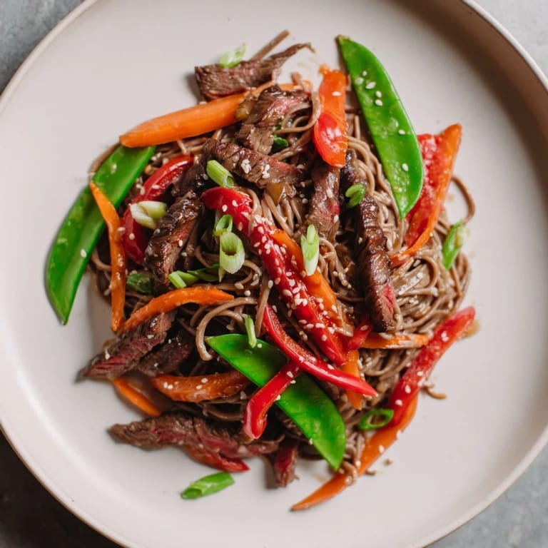 Savory Teriyaki Beef & Noodle Bowl features tender beef, colorful veggies, and coated noodles for dinner.