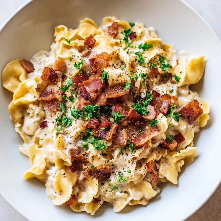 A steaming bowl of Instant Pot Carbonara Ramen Hack, rich with egg, cheese, and crispy bacon bits.